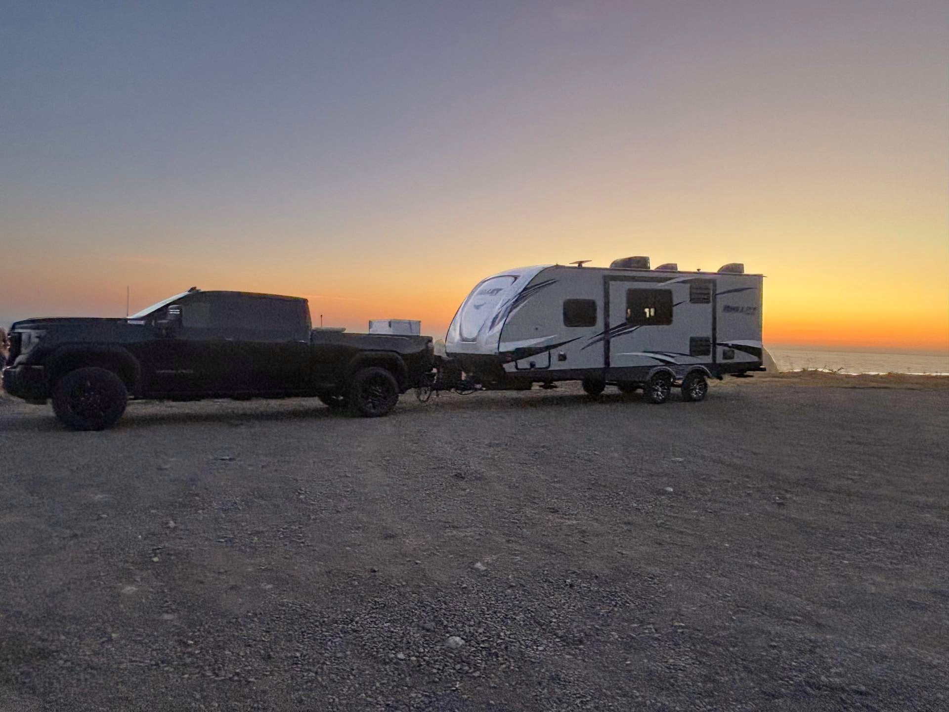 Brian's own used camper on a beach